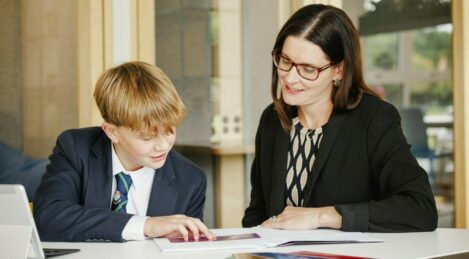 student and teacher reading